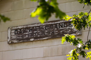 An old sign saying "Oak Hill Grange est. 1956"