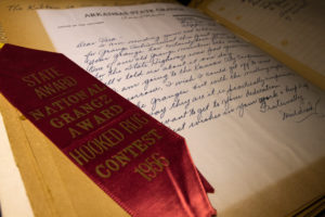 An old record book with an award inside